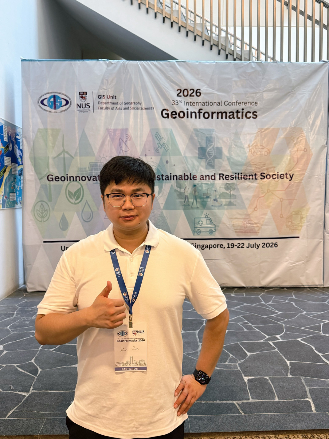 Kai Ren at the Geoinformatics 2026 conference backdrop